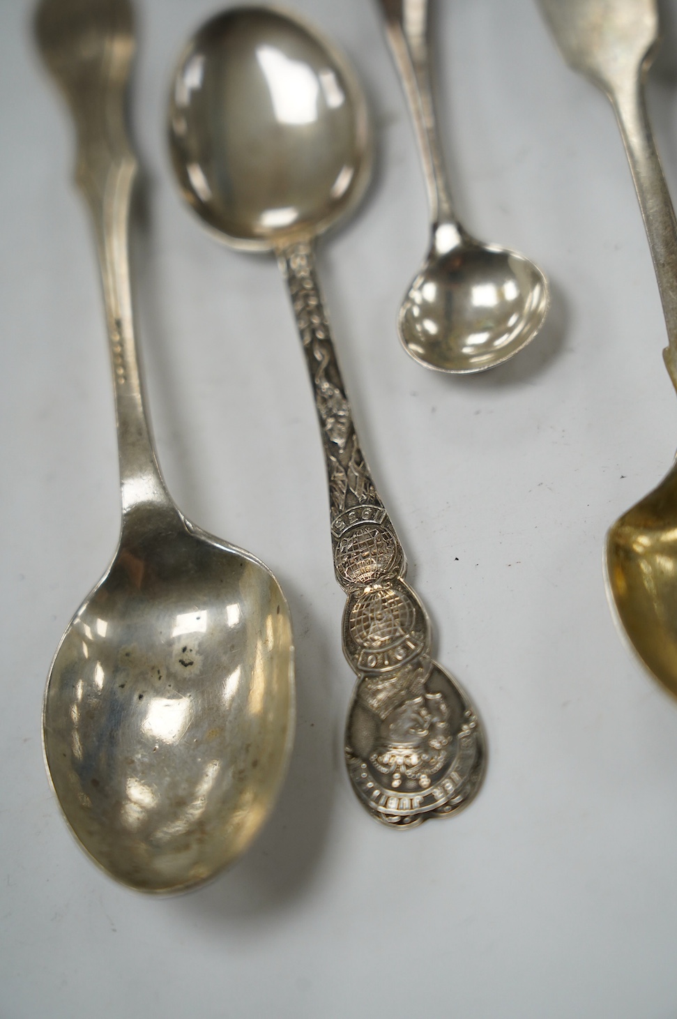 An early 18th century Hanovarian rat-tail pattern table spoon, indistinct marks, 19.6cm and a small quantity of later assorted silver flatware, 21.7oz. Condition - poor to fair